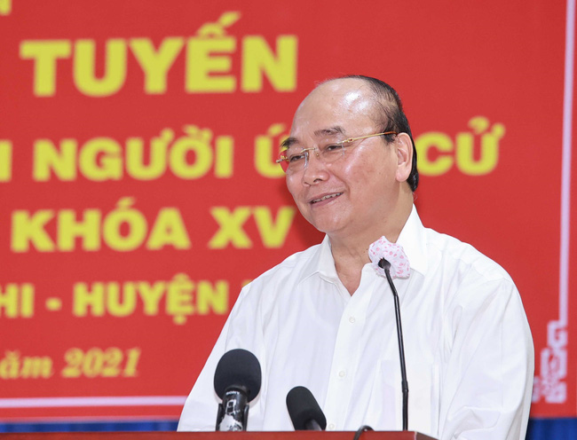 Chủ tịch nước Nguyễn Xuân Phúc trình bày chương trình hành động tại điểm cầu xã Xuân Thới Sơn, huyện Hóc Môn. Ảnh: TTXVN.